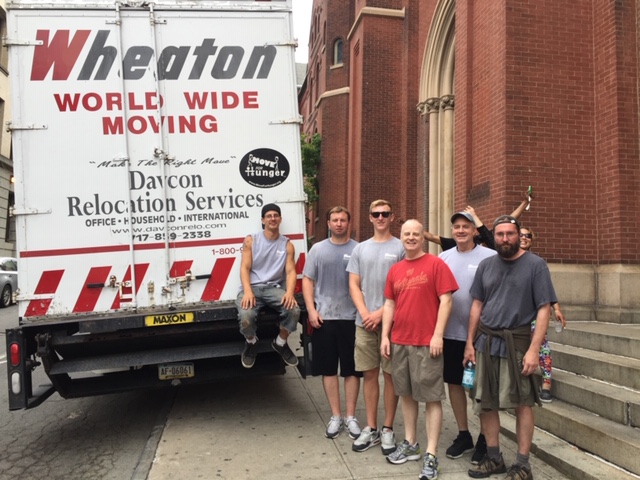 Davcon moving crew in front of moving truck